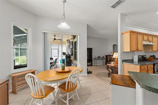 a dining room with furniture and window