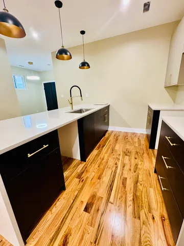 a spacious bathroom with a vanity and mirror