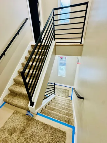 a view of empty room with a fireplace