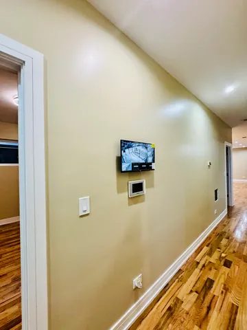 a bedroom with a bed and a mirror