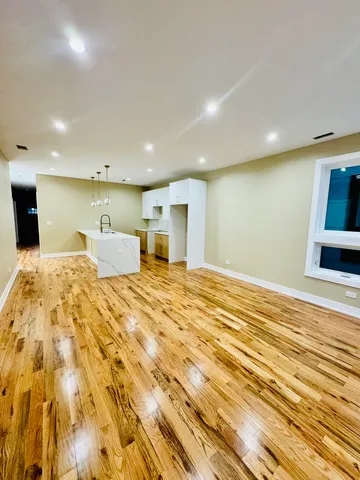 a bed room view with wooden floor