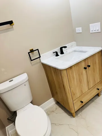 a spacious bathroom with a vanity and a mirror