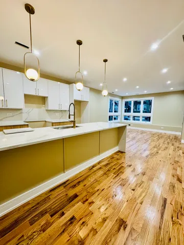 a kitchen with a sink a faucet a washer and dryer
