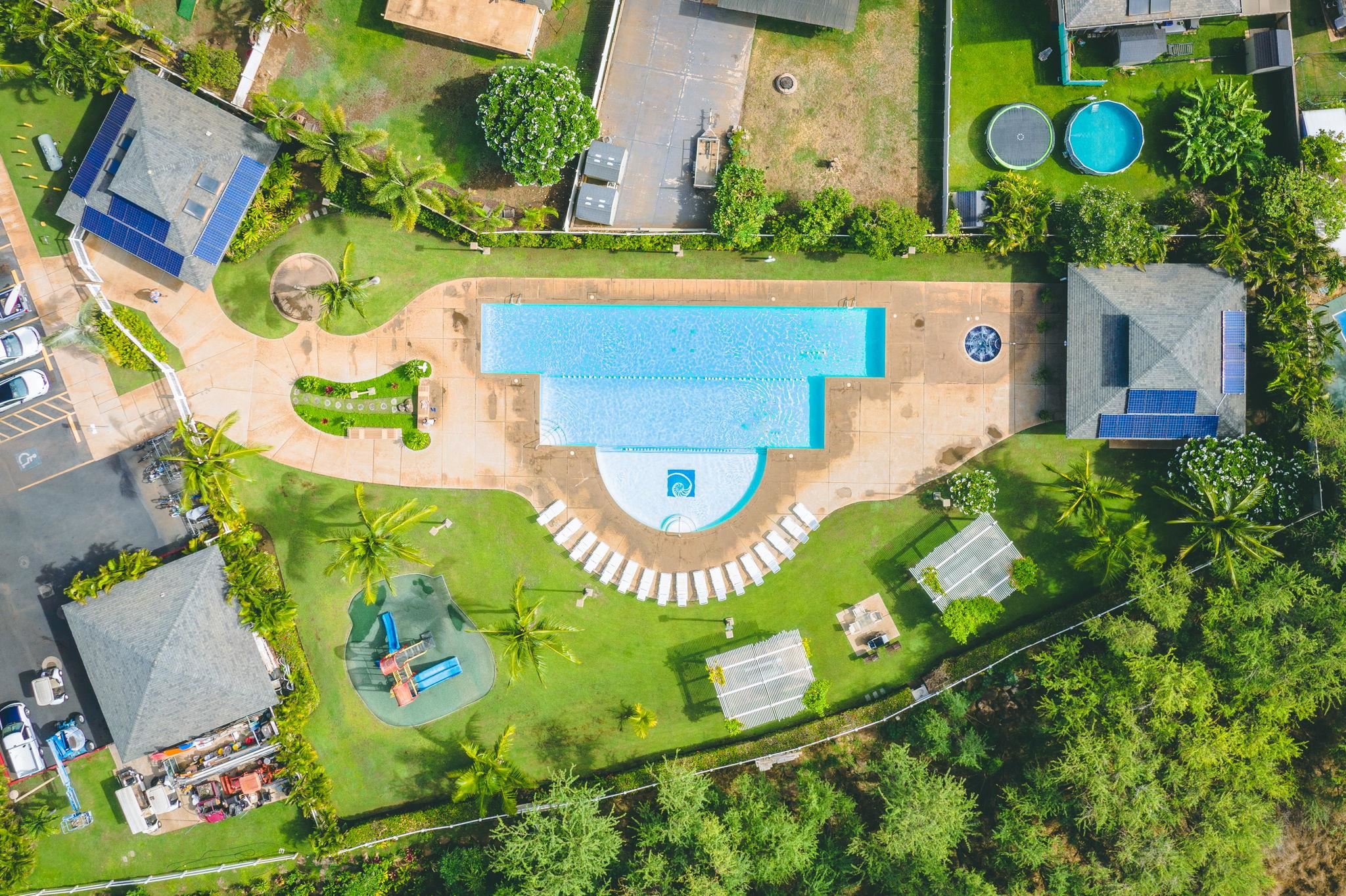 an aerial view of a pool patio and outdoor seating
