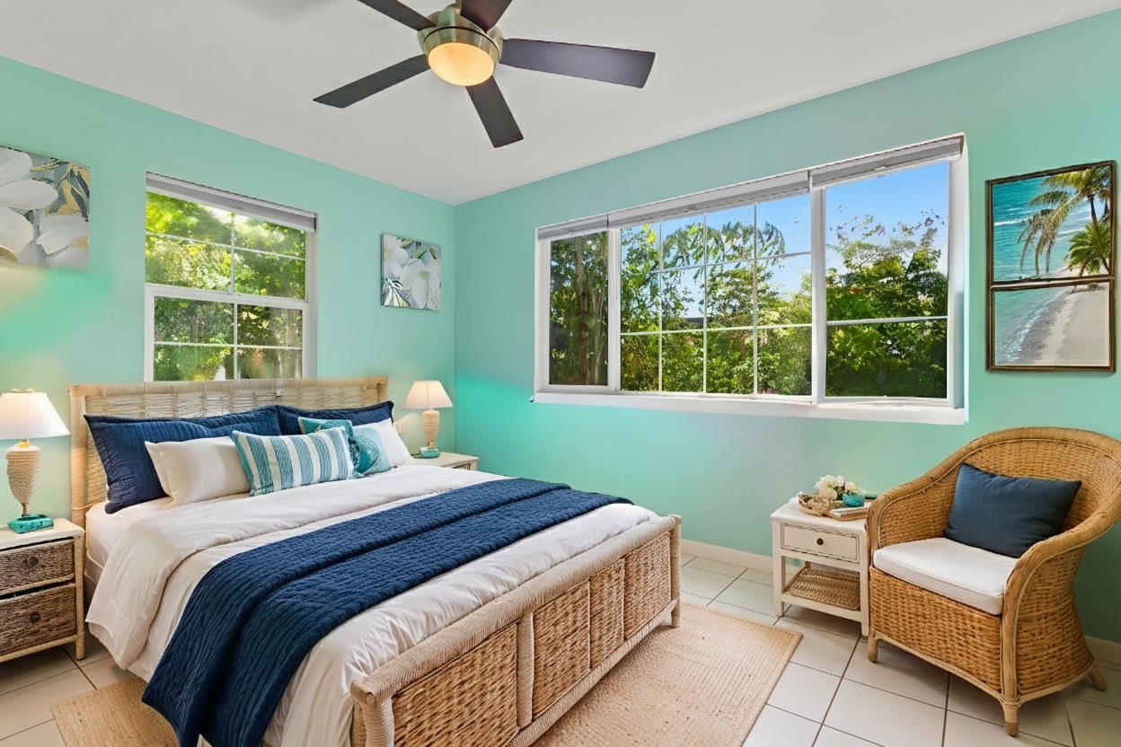 30 Halili Lane, Unit 3D Kihei, HI 96753 - Photo 22 of 46 a bedroom with a bed and a window