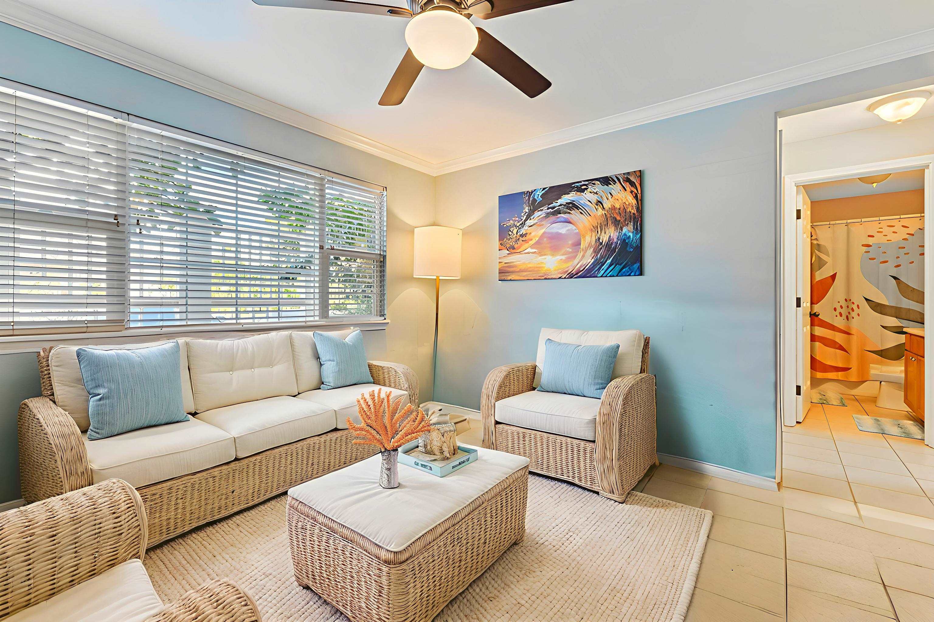 30 Halili Lane, Unit 3D Kihei, HI 96753 - Photo 5 of 46 a living room with furniture and a large window