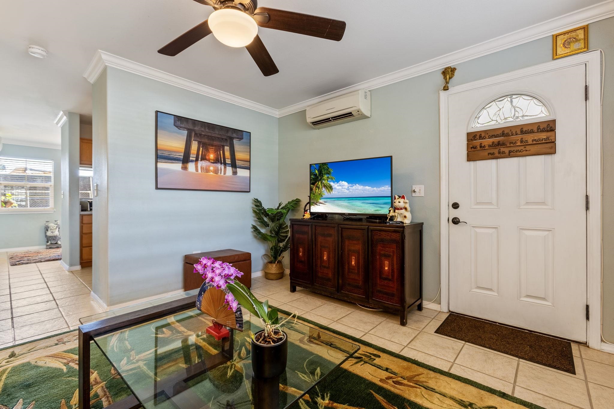 30 Halili Lane, Unit 3D Kihei, HI 96753 - Photo 7 of 46 a living room with furniture and a flat screen tv