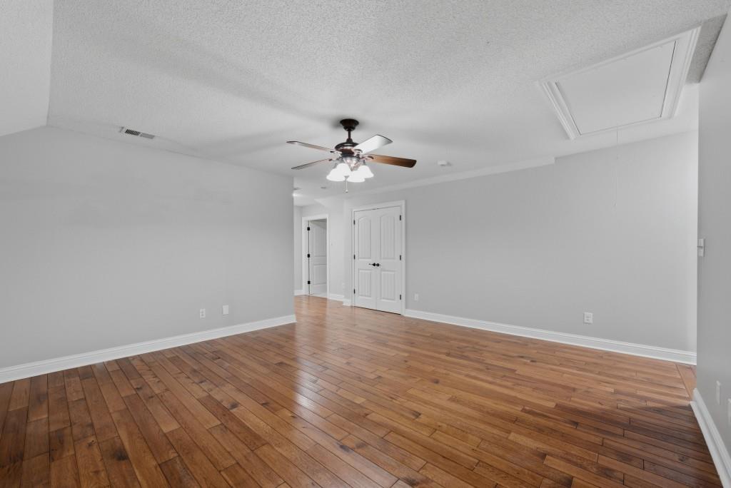 582 Knox Chapel Road Social Circle, GA 30025 - Photo 27 of 49 a view of an empty room with wooden floor