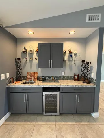 a kitchen with a sink and cabinets