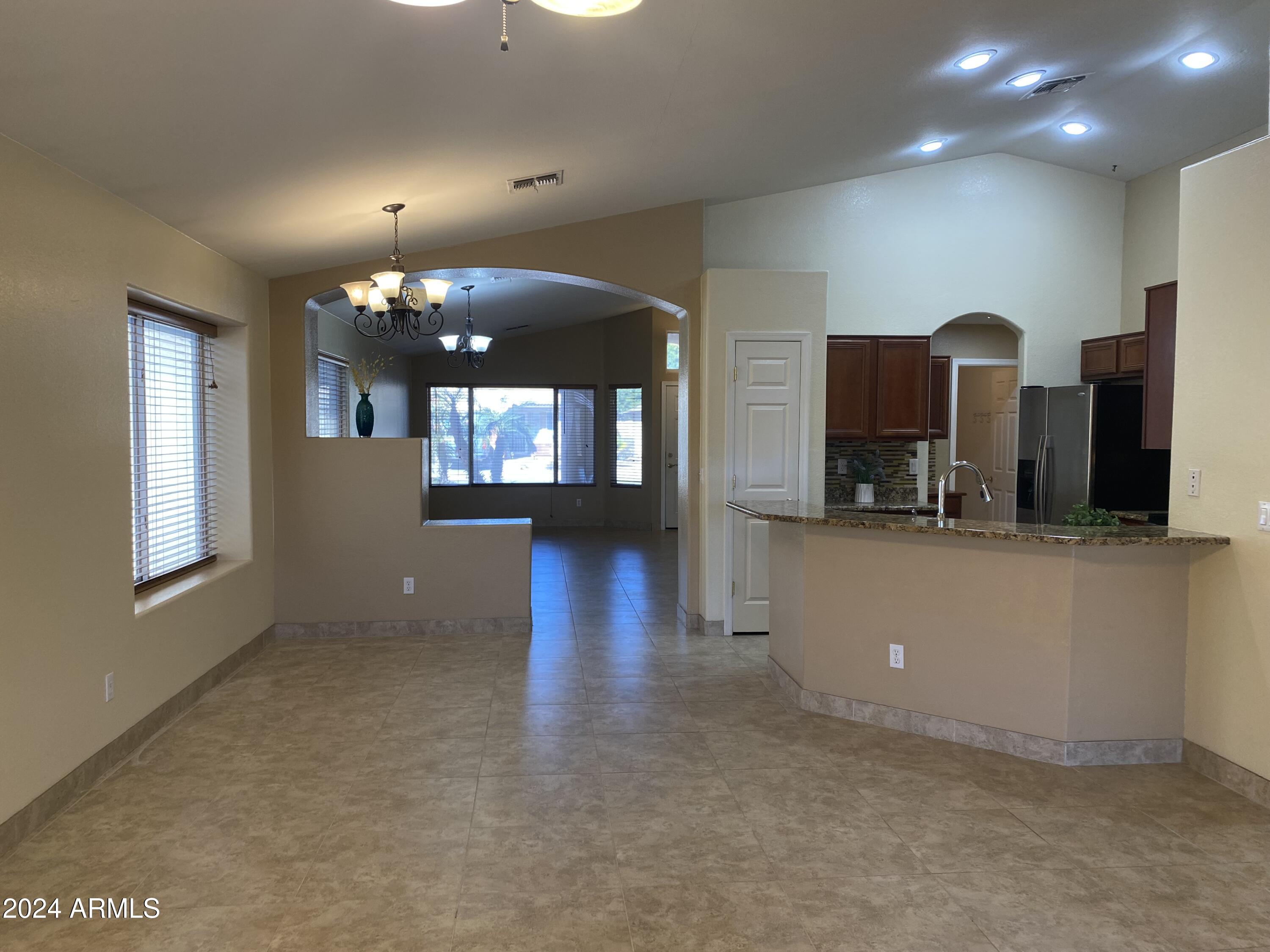 8143 West Marco Polo Road Peoria, AZ 85382 - Photo 13 of 29 a view of a house kitchen and dining room