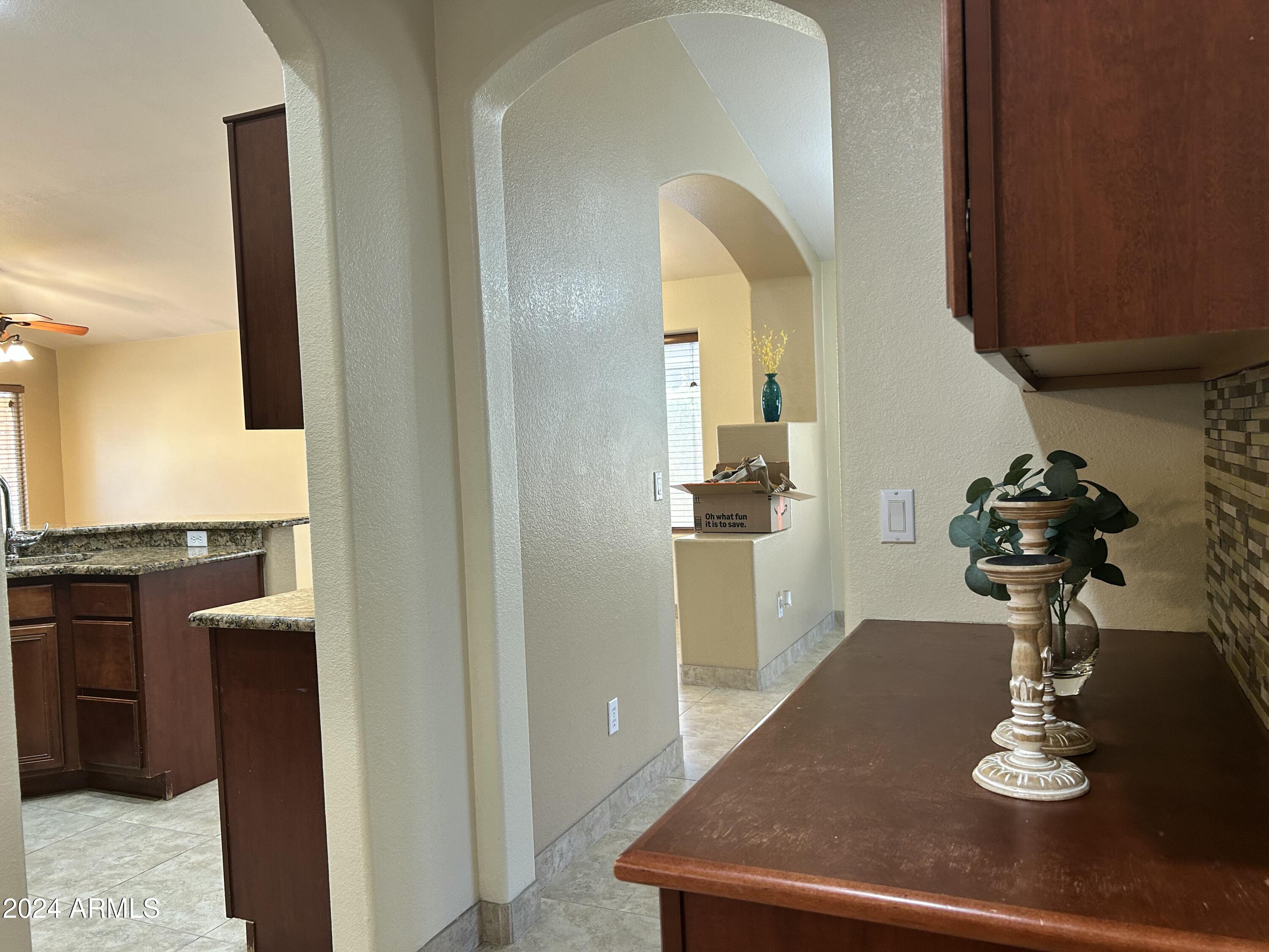 8143 West Marco Polo Road Peoria, AZ 85382 - Photo 14 of 29 a view of kitchen and living room