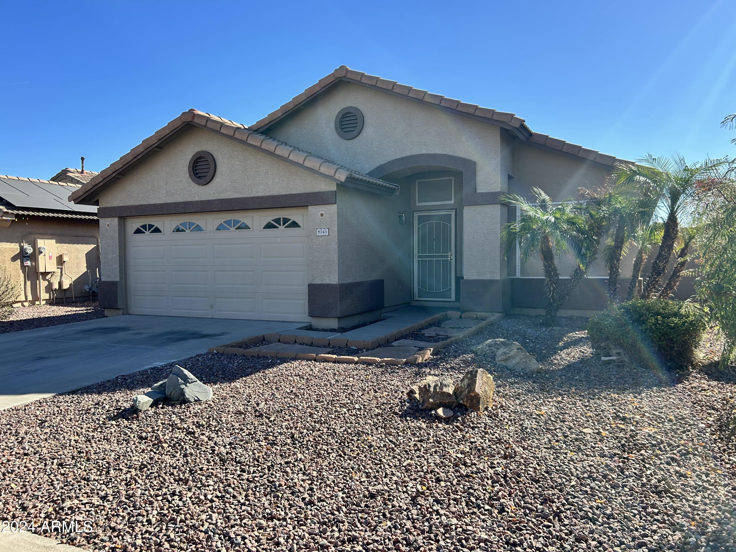 8143 West Marco Polo Road Peoria, AZ 85382 - Photo 2 of 29 a front view of a house with a yard