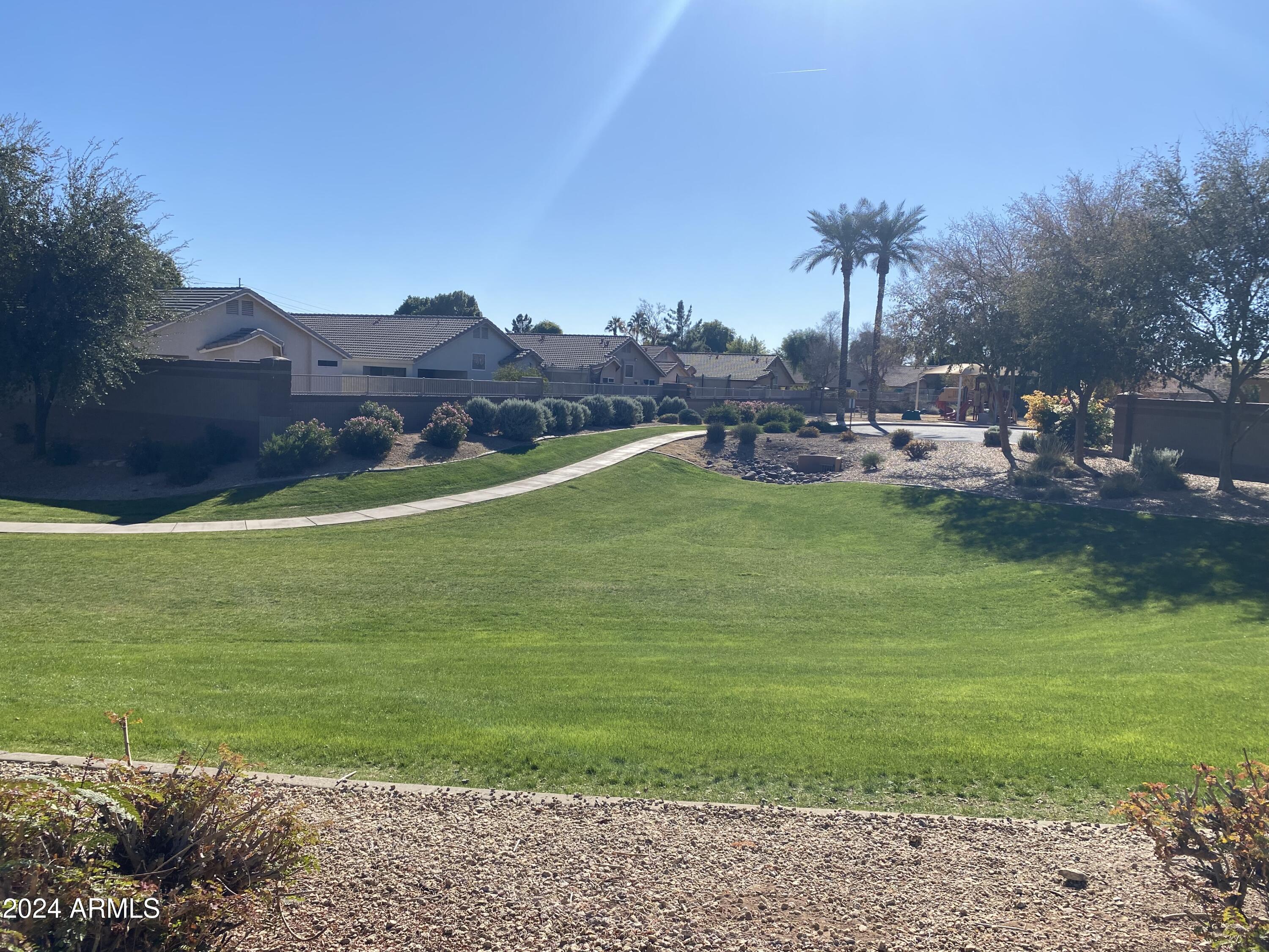 8143 West Marco Polo Road Peoria, AZ 85382 - Photo 29 of 29 a view of a table and chairs in the garden