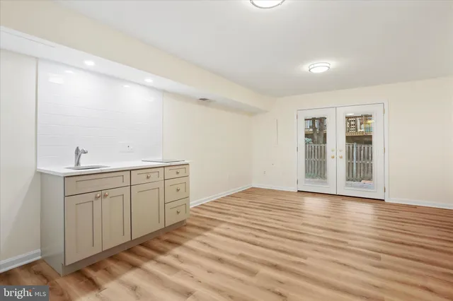 a spacious bathroom with a sink mirror and vanity