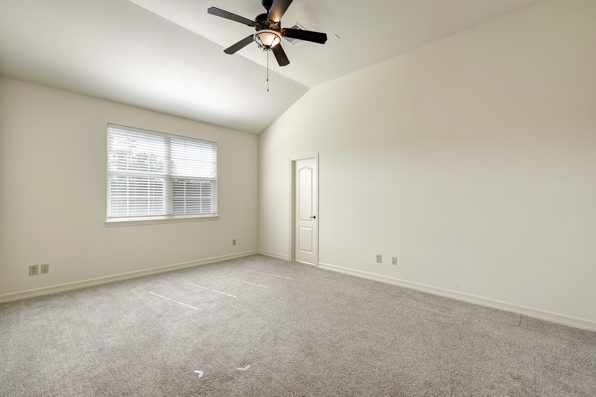 10348 Stone Gate Drive Conroe, TX 77385 - Photo 11 of 20 an empty room with windows and fan view