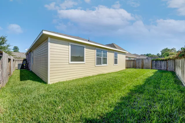 a backyard of a house with lots of green space