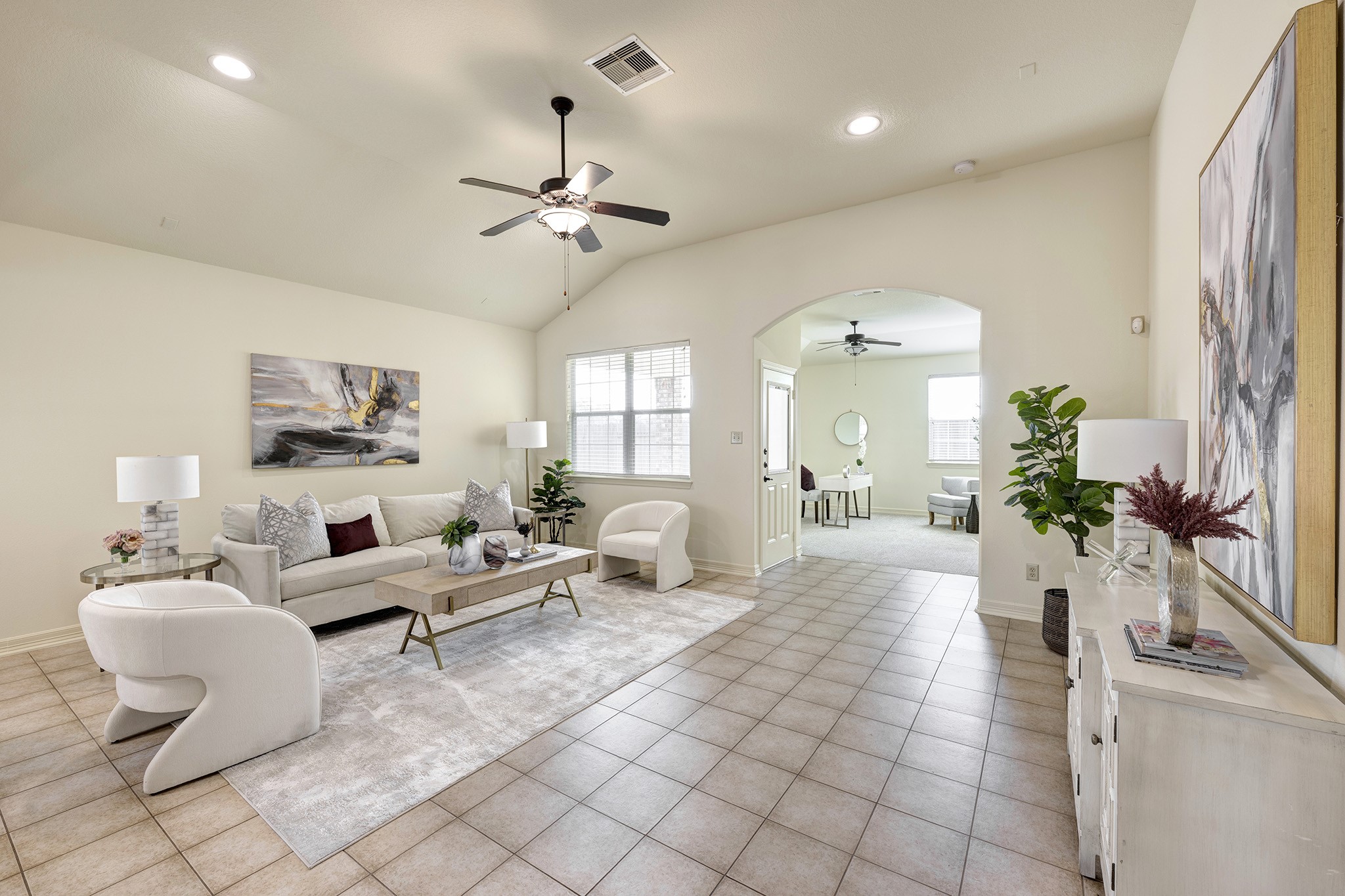 10348 Stone Gate Drive Conroe, TX 77385 - Photo 8 of 20 a living room with furniture and a chandelier