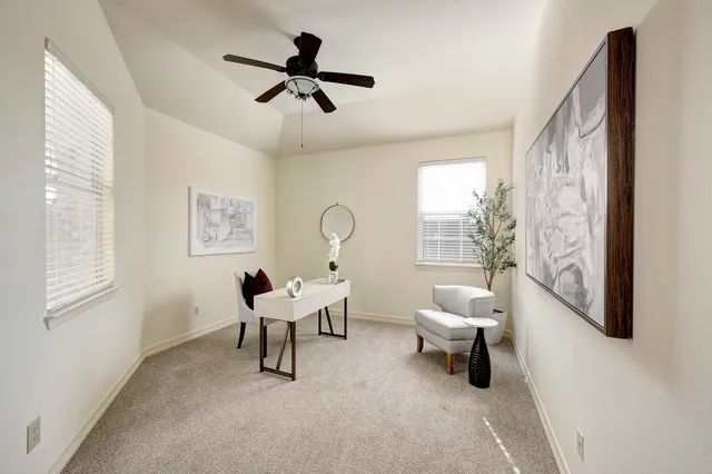 a living room with furniture and a window