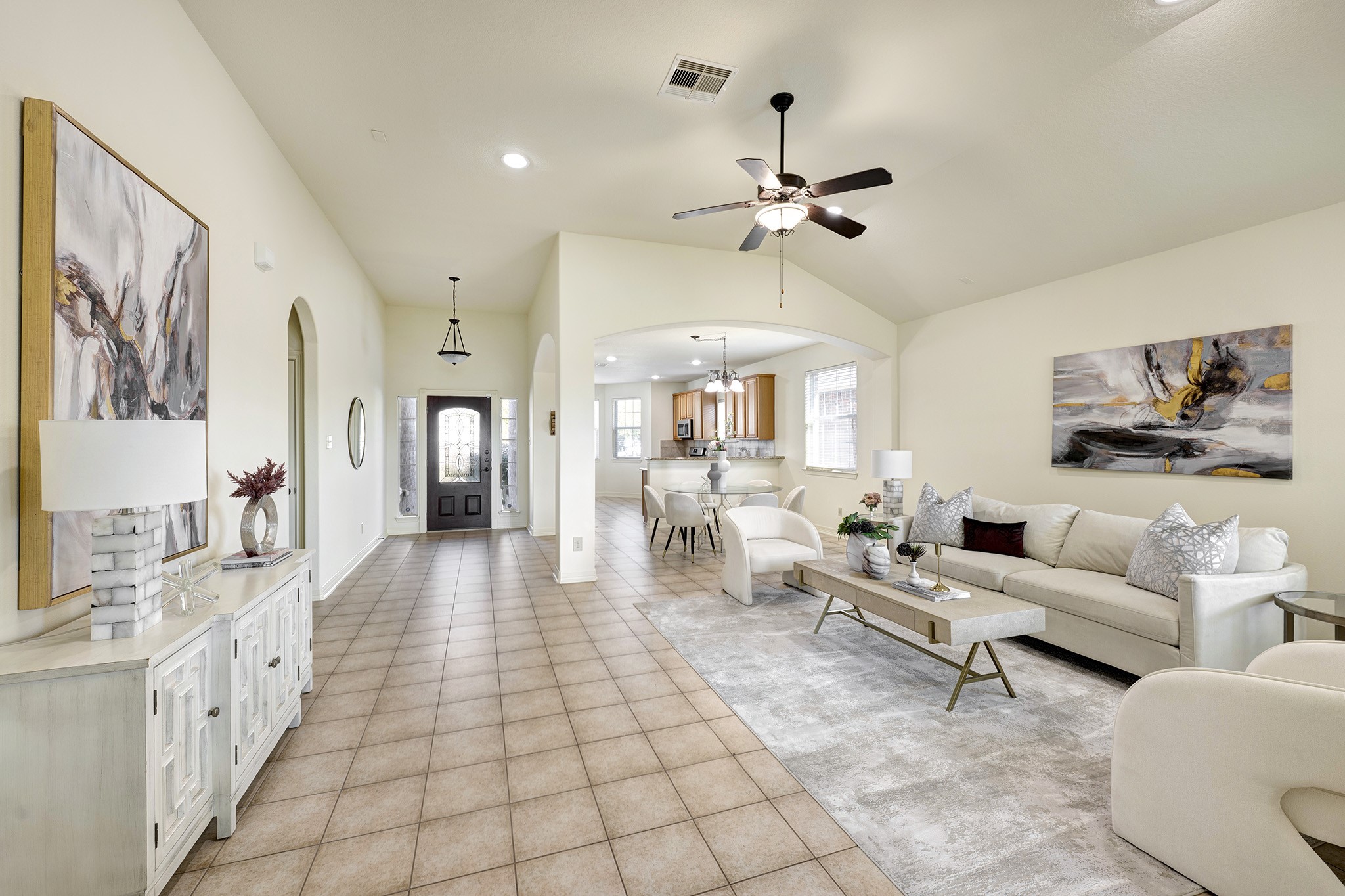 10348 Stone Gate Drive Conroe, TX 77385 - Photo 10 of 20 a living room with furniture and a chandelier