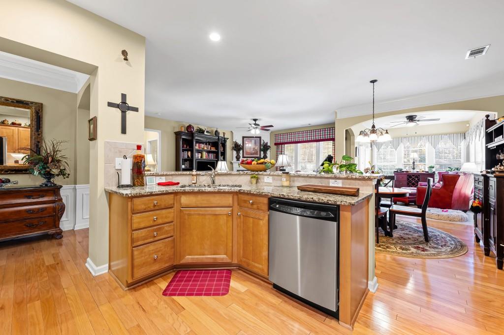 1081 Spring Station Road Greensboro, GA 30642 - Photo 13 of 35 a kitchen with stainless steel appliances granite countertop a kitchen island a stove and a sink