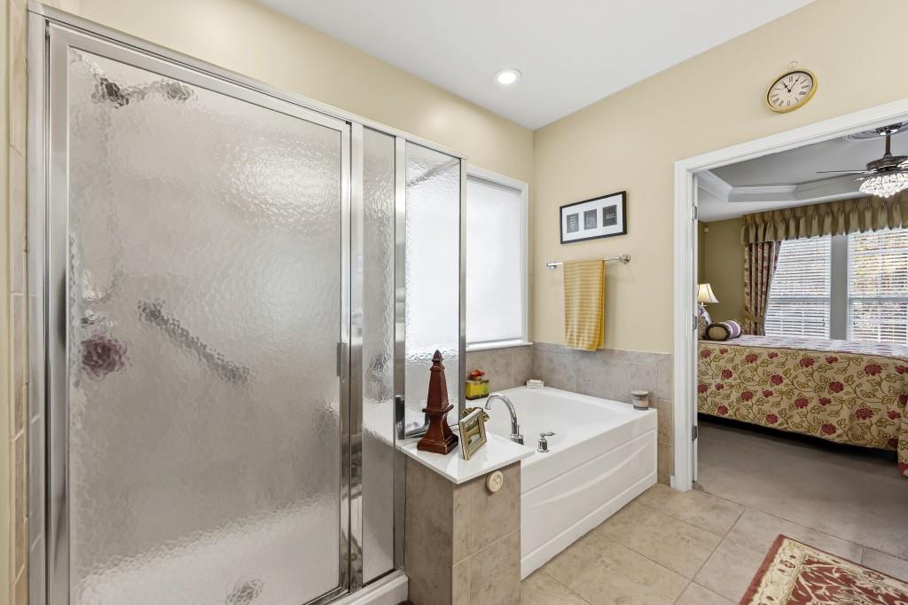 1081 Spring Station Road Greensboro, GA 30642 - Photo 22 of 35 a bathroom with a tub and a mirror