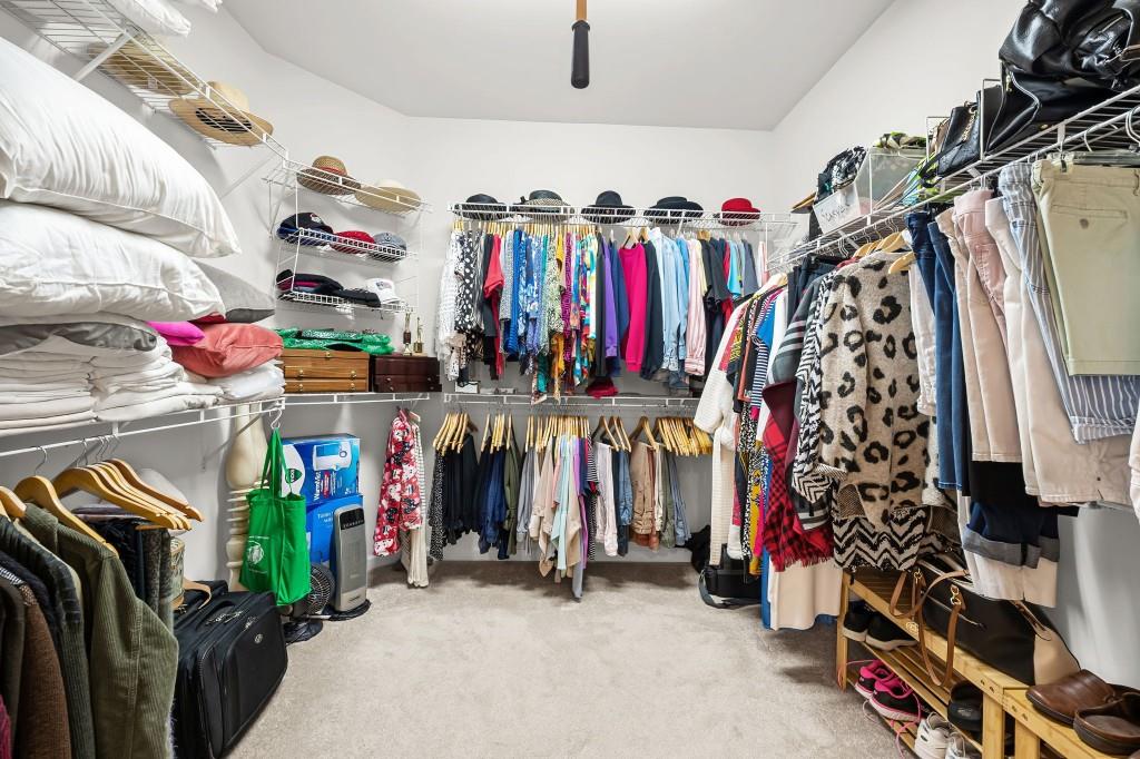 1081 Spring Station Road Greensboro, GA 30642 - Photo 23 of 35 a view of walk in closet with clothes and shoes