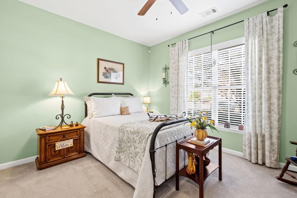 1081 Spring Station Road Greensboro, GA 30642 - Photo 24 of 35 a bedroom with a bed and a window