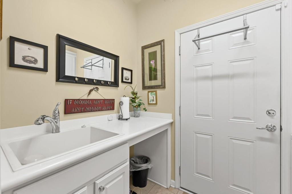 1081 Spring Station Road Greensboro, GA 30642 - Photo 29 of 35 a bathroom with a sink and a mirror