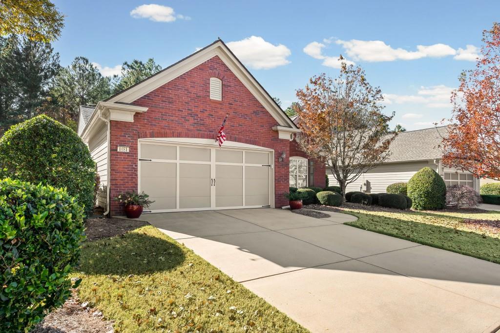 1081 Spring Station Road Greensboro, GA 30642 - Photo 3 of 35 a front view of a house with a yard and garage