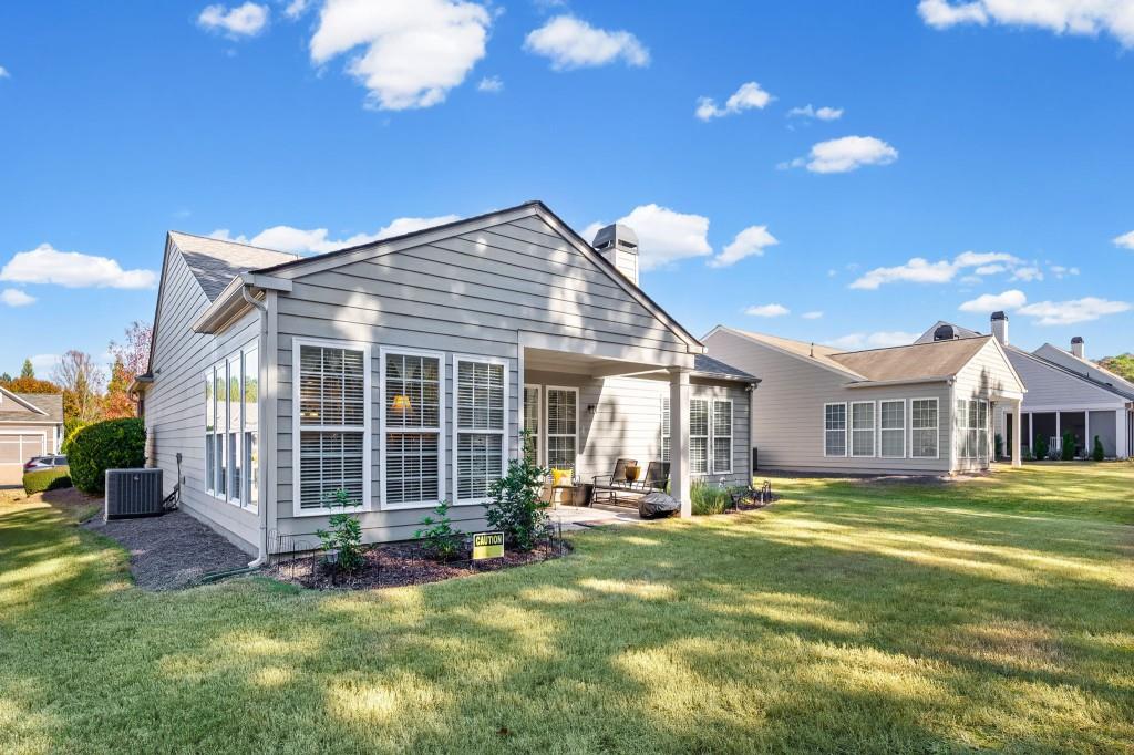 1081 Spring Station Road Greensboro, GA 30642 - Photo 32 of 35 a front view of a house with a garden