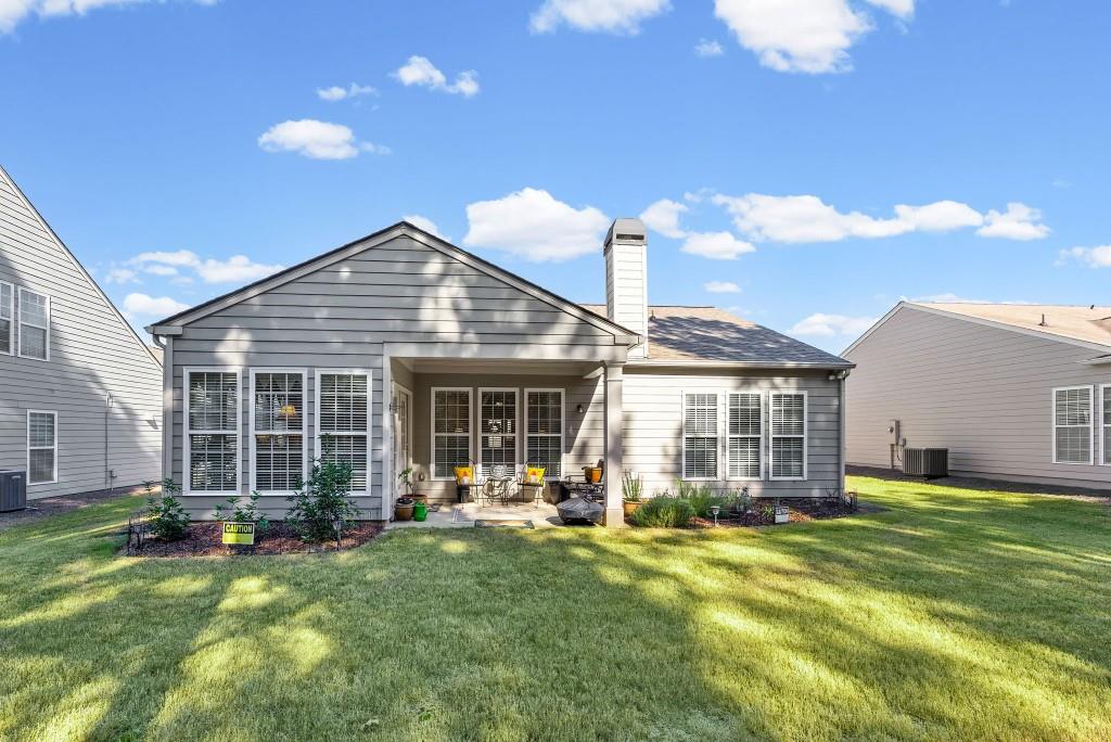 1081 Spring Station Road Greensboro, GA 30642 - Photo 33 of 35 a backyard of a house with yard and outdoor seating