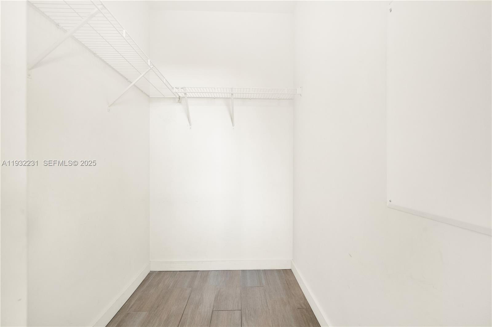 1600 Southwest 1st Avenue, Unit 804 Miami, FL 33129 - Photo 11 of 31 a view of a room with wooden floor