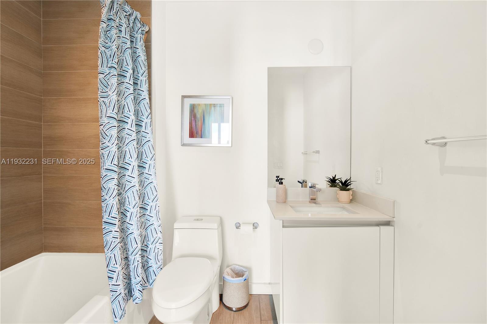 1600 Southwest 1st Avenue, Unit 804 Miami, FL 33129 - Photo 12 of 31 a bathroom with a sink toilet and shower