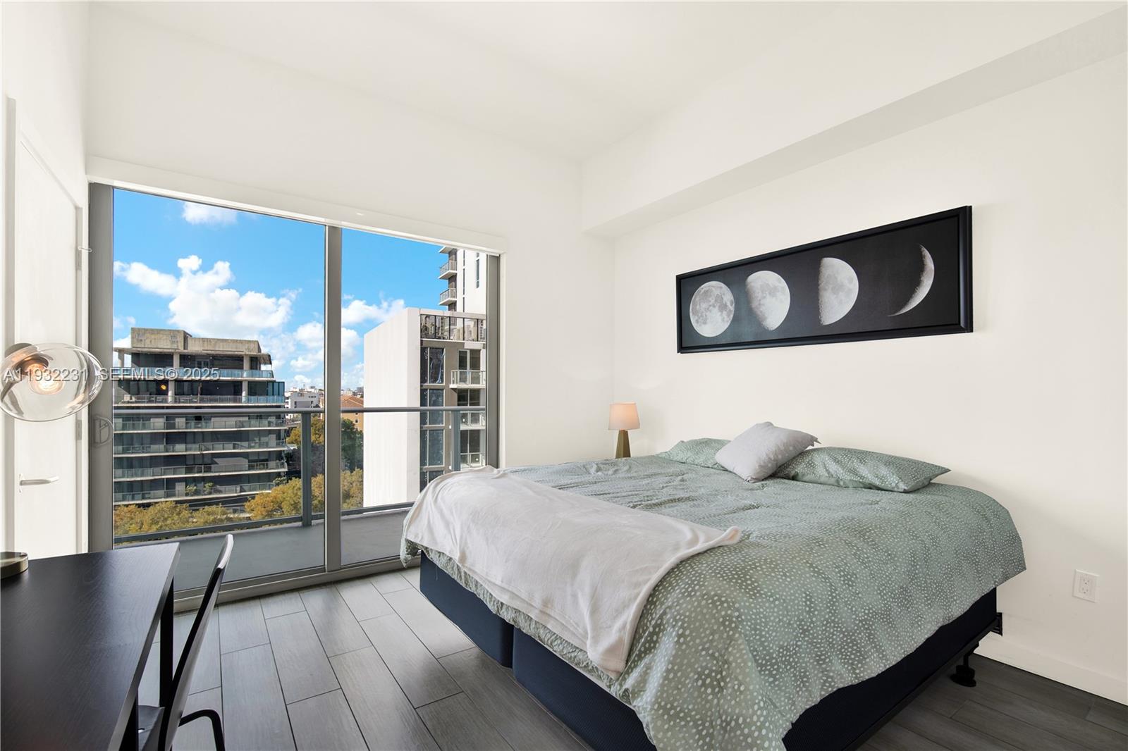 1600 Southwest 1st Avenue, Unit 804 Miami, FL 33129 - Photo 10 of 31 a bedroom with a bed and a view of kitchen