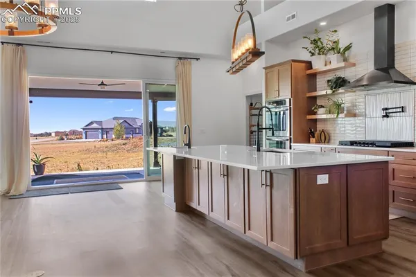 a open kitchen with stainless steel appliances granite countertop a stove and cabinets