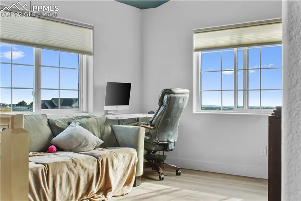 a bedroom with furniture and a window