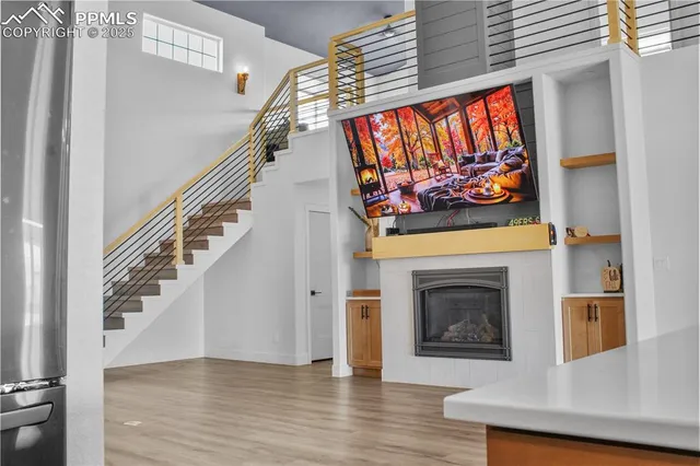 a view of an entryway and wooden floor