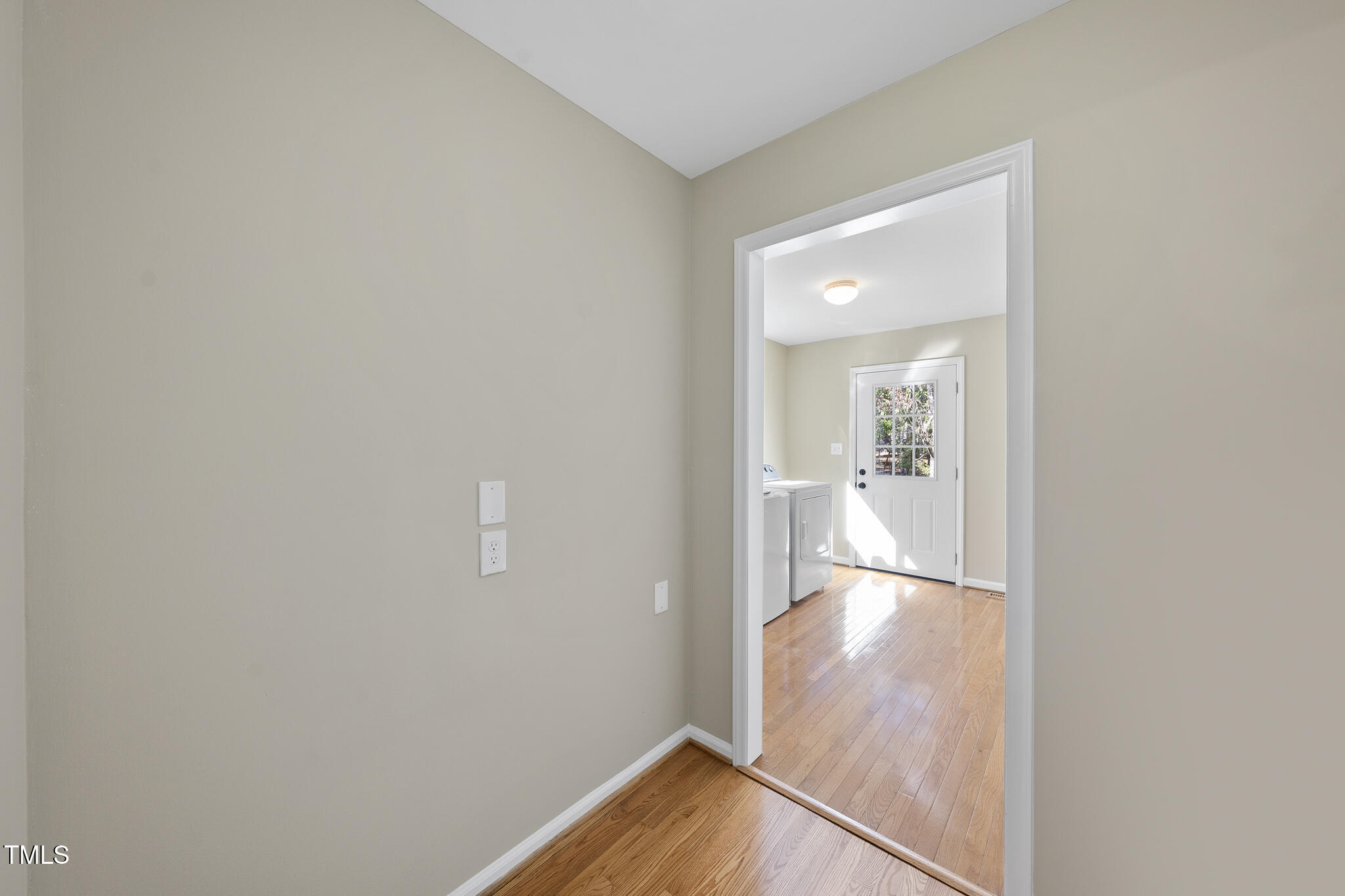 8063 Hogan Drive Wake Forest, NC 27587 - Photo 11 of 46 a view of a hallway with wooden floor