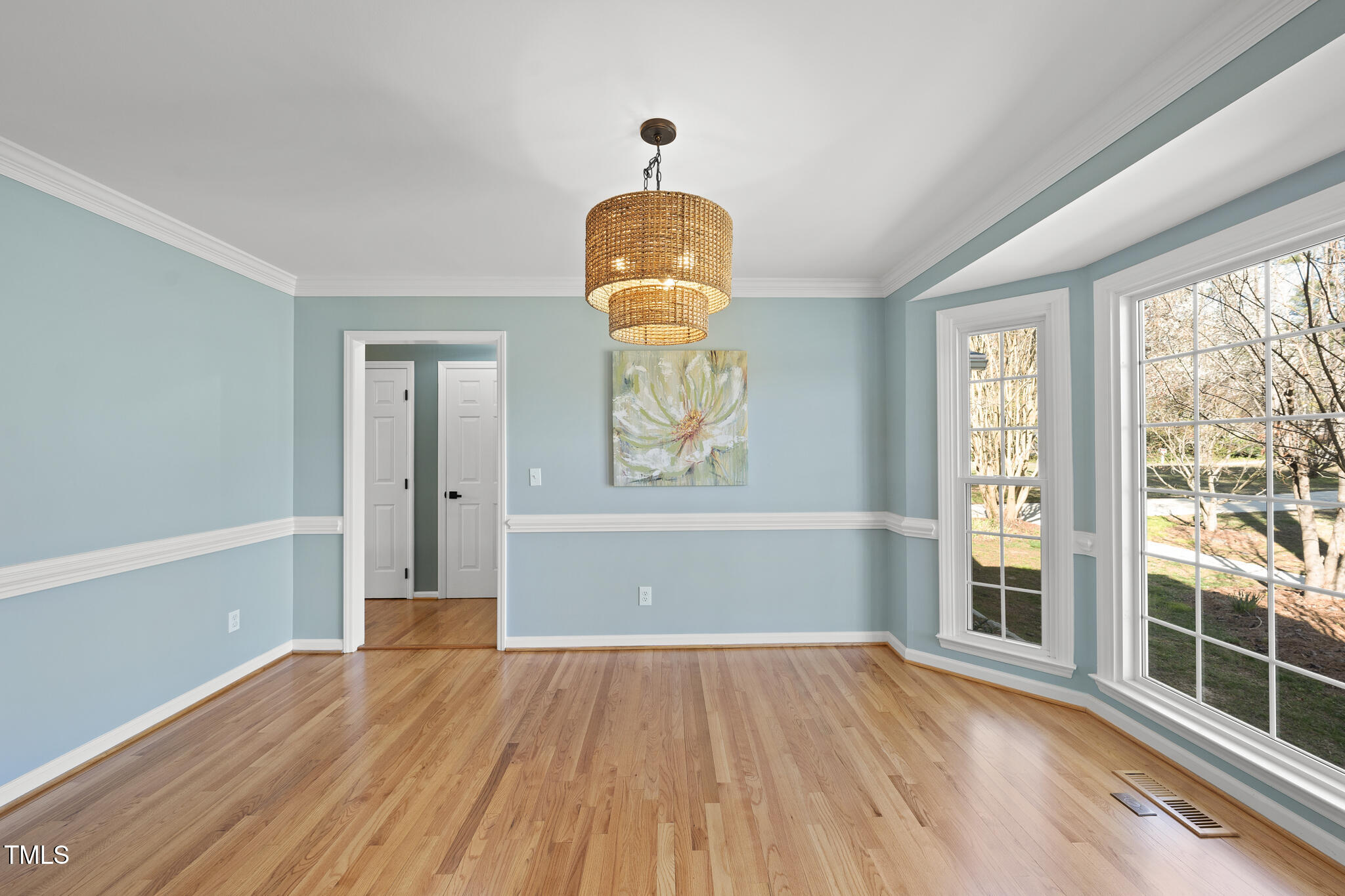 8063 Hogan Drive Wake Forest, NC 27587 - Photo 13 of 46 a view of empty room with wooden floor and fan