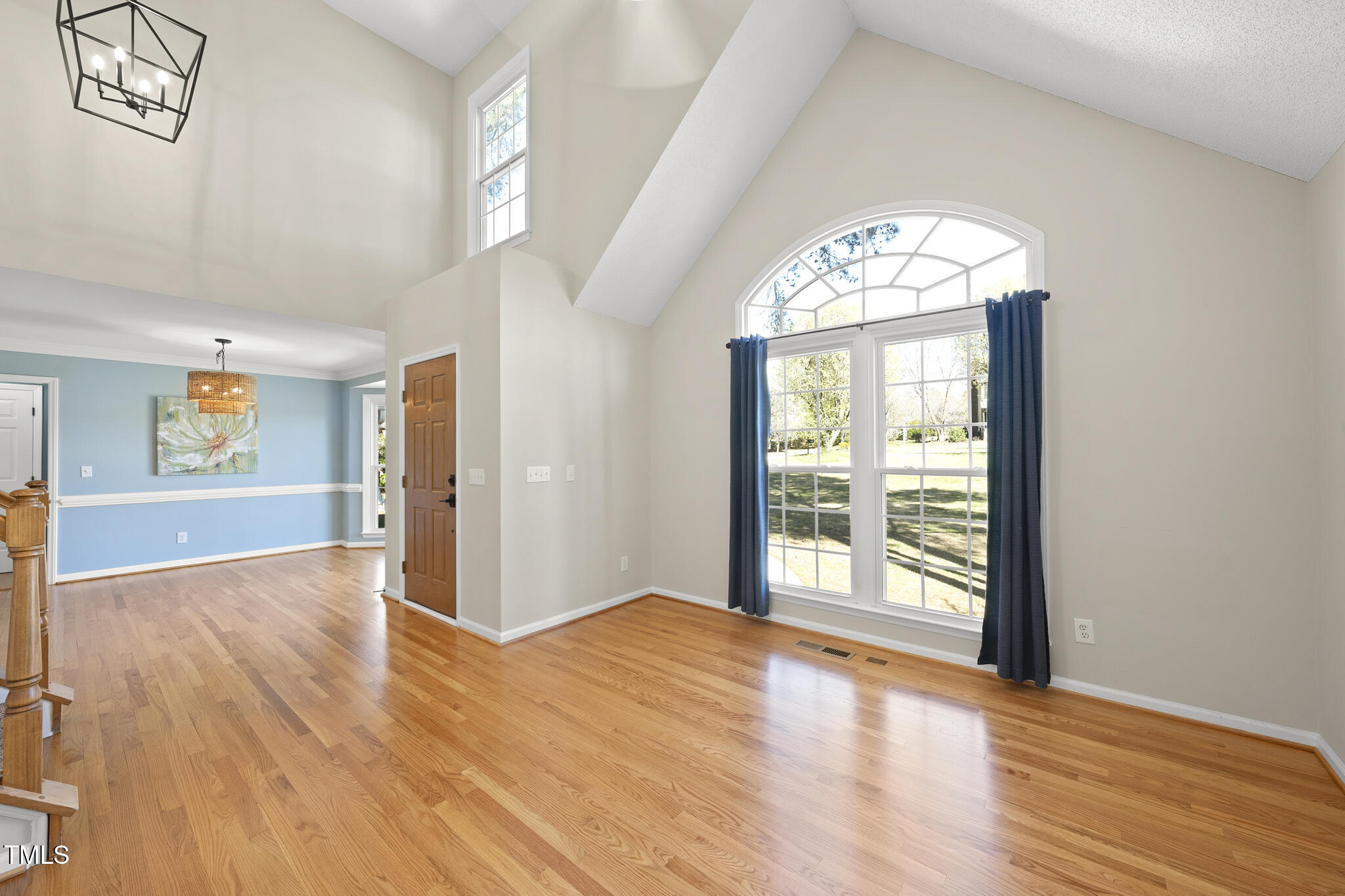 8063 Hogan Drive Wake Forest, NC 27587 - Photo 14 of 46 wooden floor in an empty room with a window