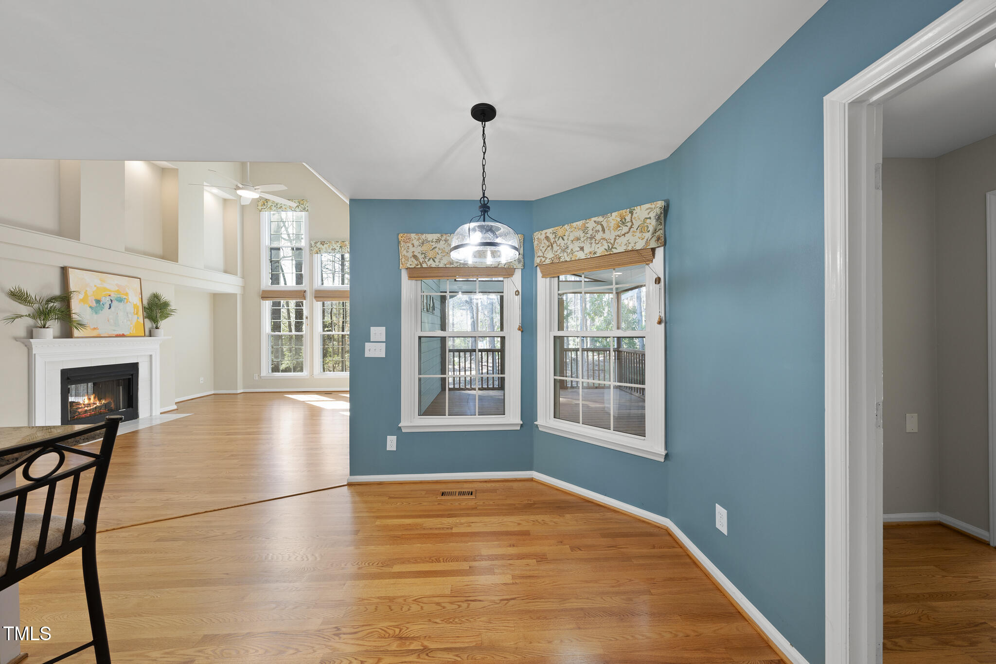 8063 Hogan Drive Wake Forest, NC 27587 - Photo 22 of 46 a view of an empty room with a window and wooden floor