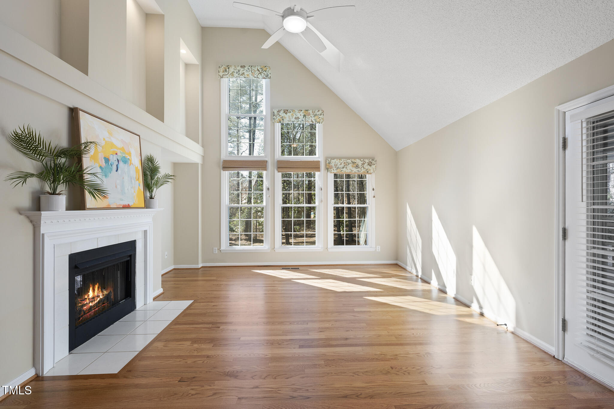 8063 Hogan Drive Wake Forest, NC 27587 - Photo 23 of 46 a view of an empty room with wooden floor and a window