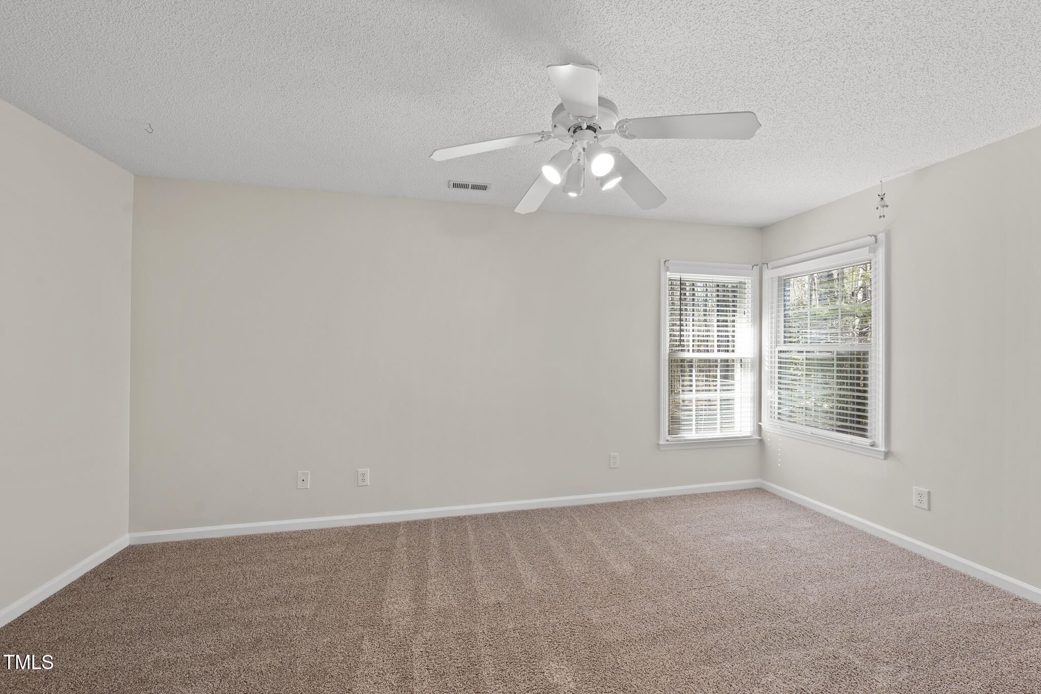 8063 Hogan Drive Wake Forest, NC 27587 - Photo 37 of 46 a view of an empty room with a window