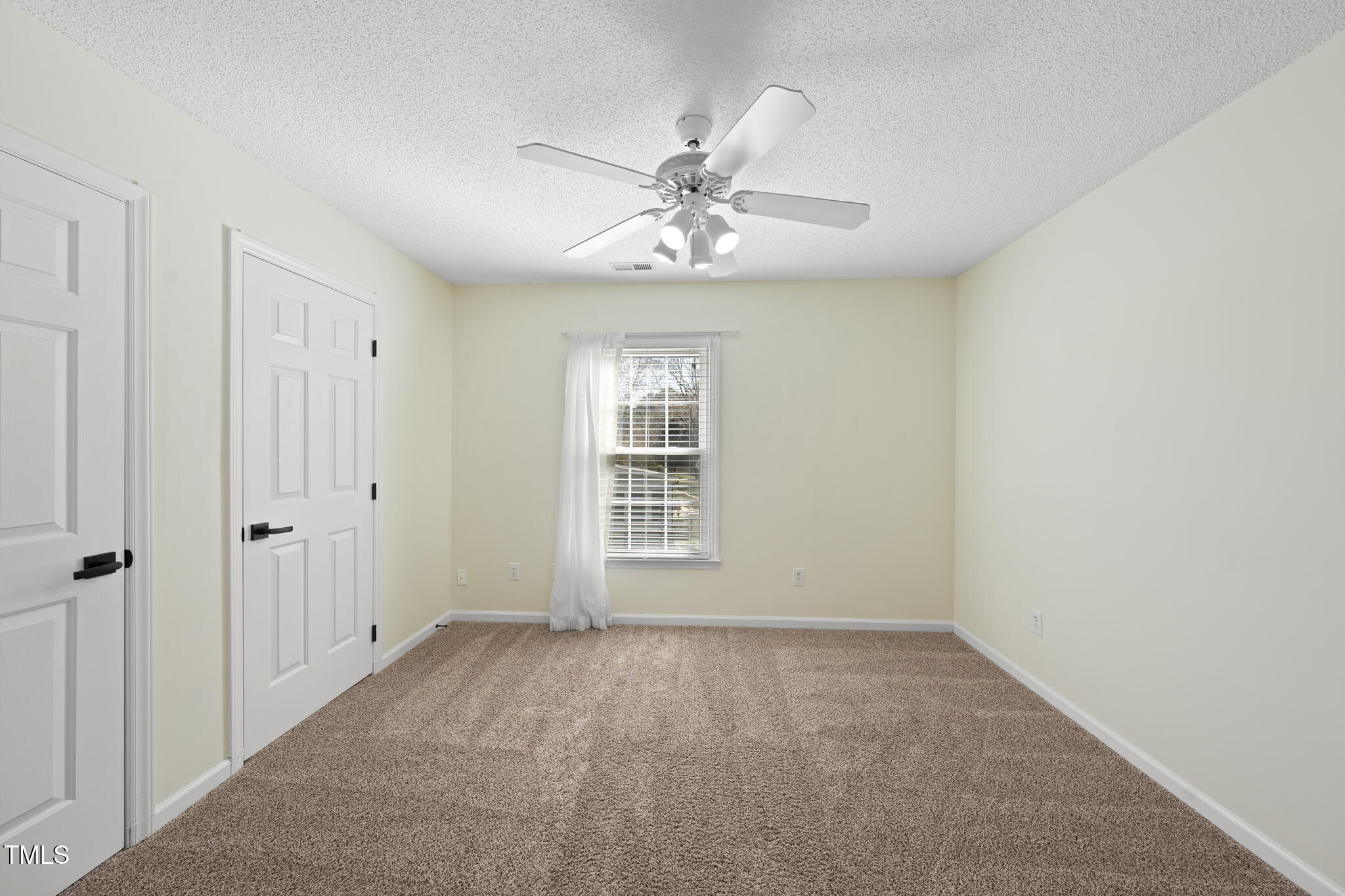 8063 Hogan Drive Wake Forest, NC 27587 - Photo 41 of 46 a view of an empty room with a window