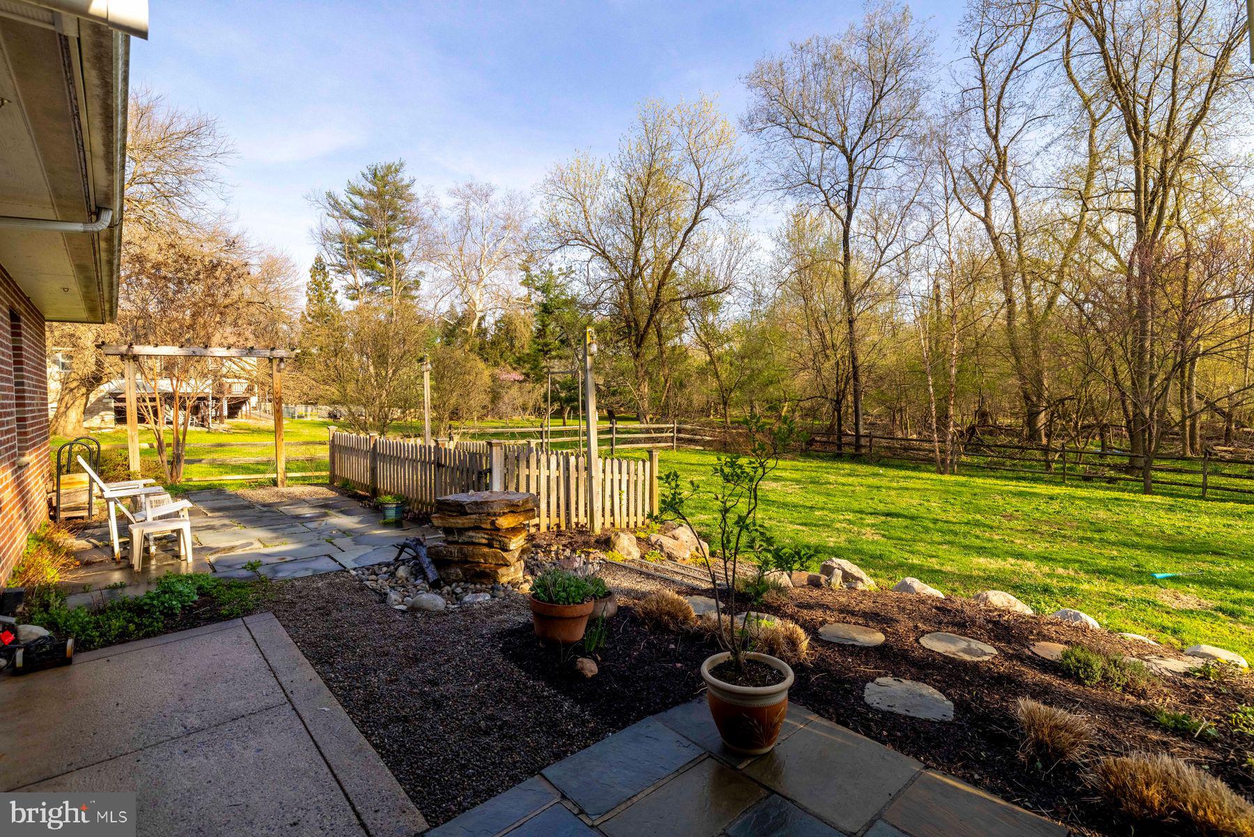 6254 West Valley Green Road Flourtown, PA 19031 - Photo 18 of 20 Serene backyard with lush greenery.
