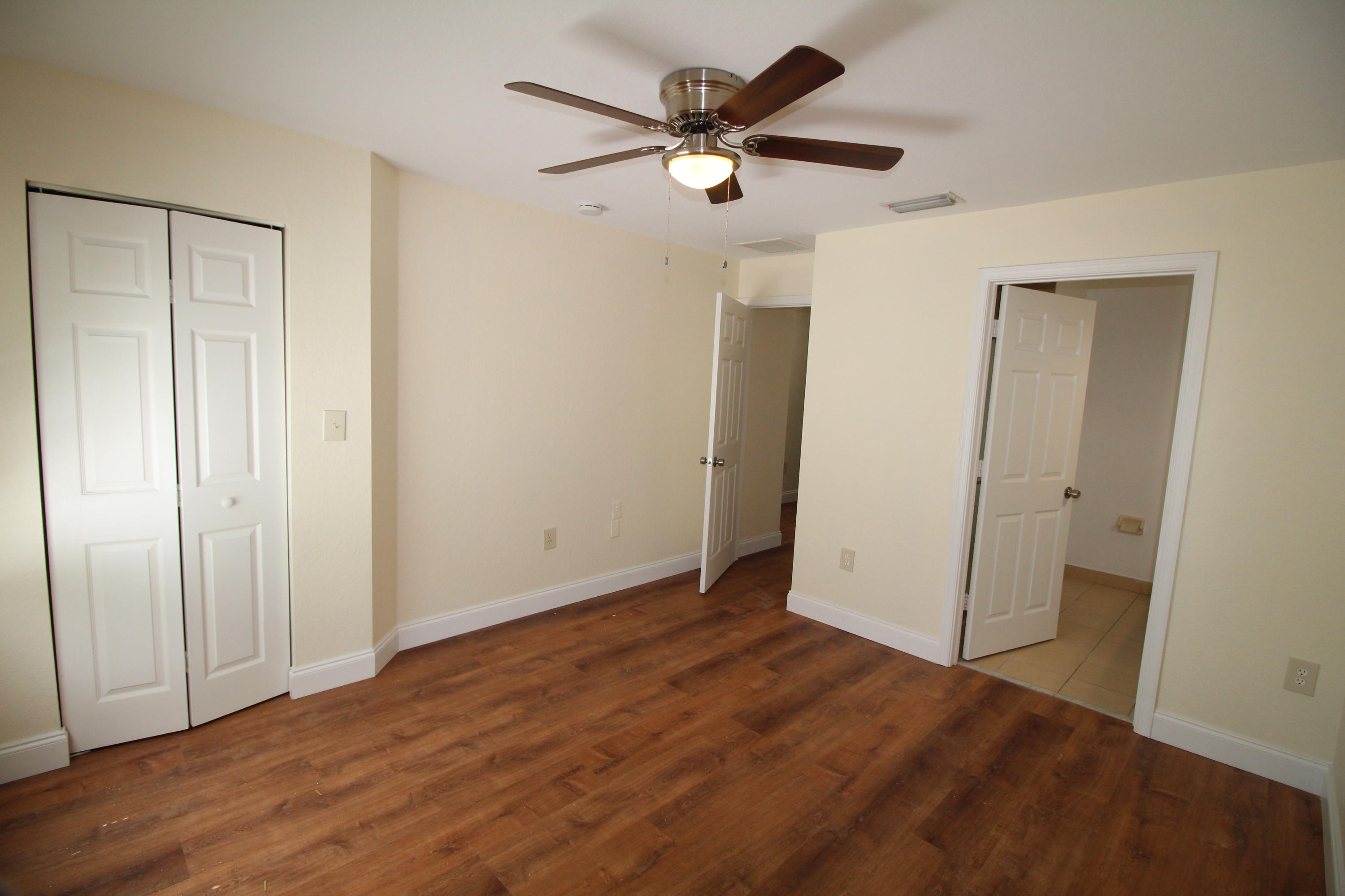 6375 Landings Way, Unit 6375 Tamarac, FL 33321 - Photo 7 of 14 wooden floor in an empty room
