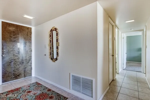 a view of room with window and bathroom