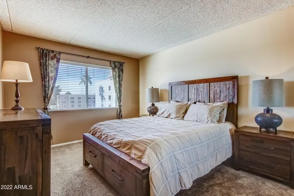 a bedroom with a bed and window