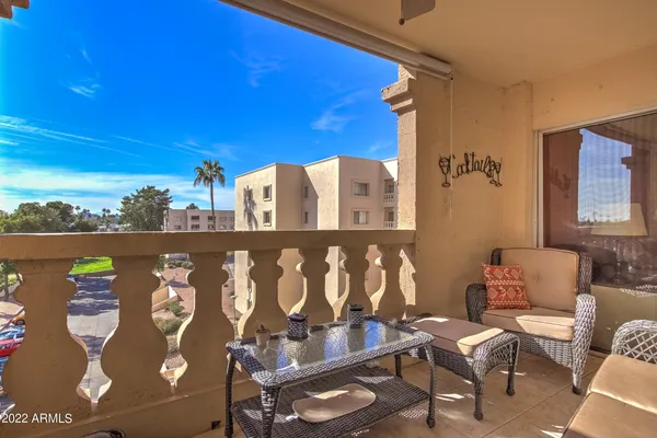 a view of a living room with a rug and a table