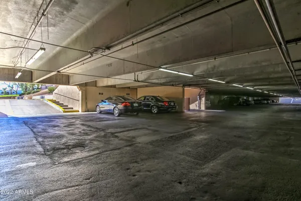 a view of a garage with cars